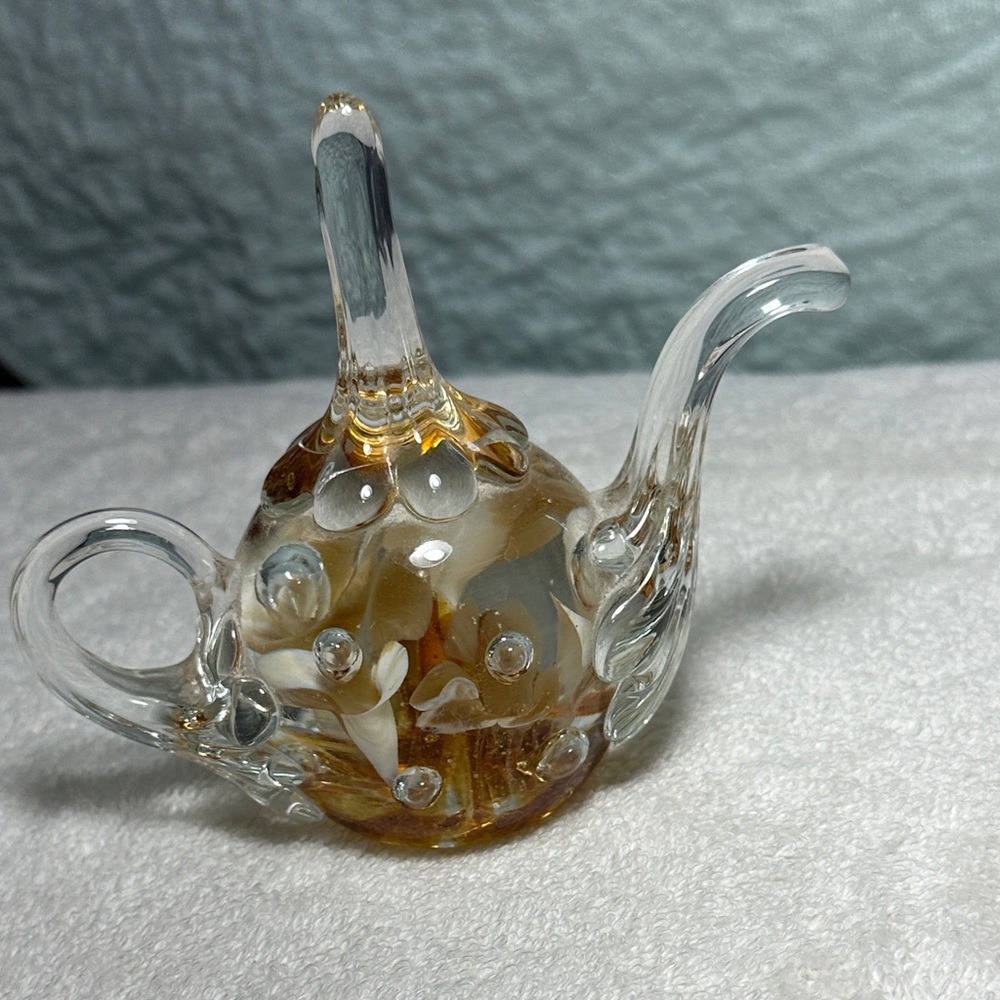 Artistic Glass Teapot Sculpture with Gold Hues